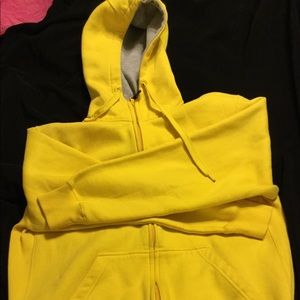 Men’s Champs yellow heavy hoodie in size XL.